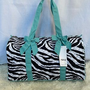 Duffel bag with zebra print and blue trim